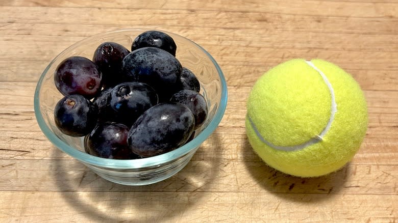 Grapes and tennis ball