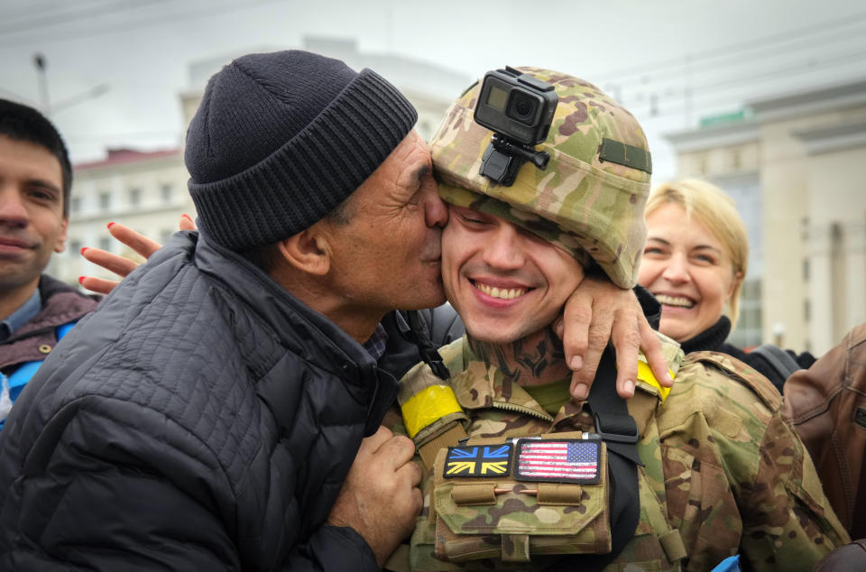 FILE - A Kherson resident kisses a Ukrainian soldier in central Kherson, Ukraine, Sunday, Nov. 13, 2022. The Russian retreat from Kherson marked a triumphant milestone in Ukraine's pushback against Moscow's invasion almost nine months ago. Amid the death and destruction war leaves in its wake, there are powerful dynamics and narratives: domination, besieged populations, occupation and their counterparts, resistance, freedom and liberation. Vast swaths of Western and Eastern Europe and the Soviet Union knew this well at various points of the 20th century. (AP Photo/Efrem Lukatsky, File)