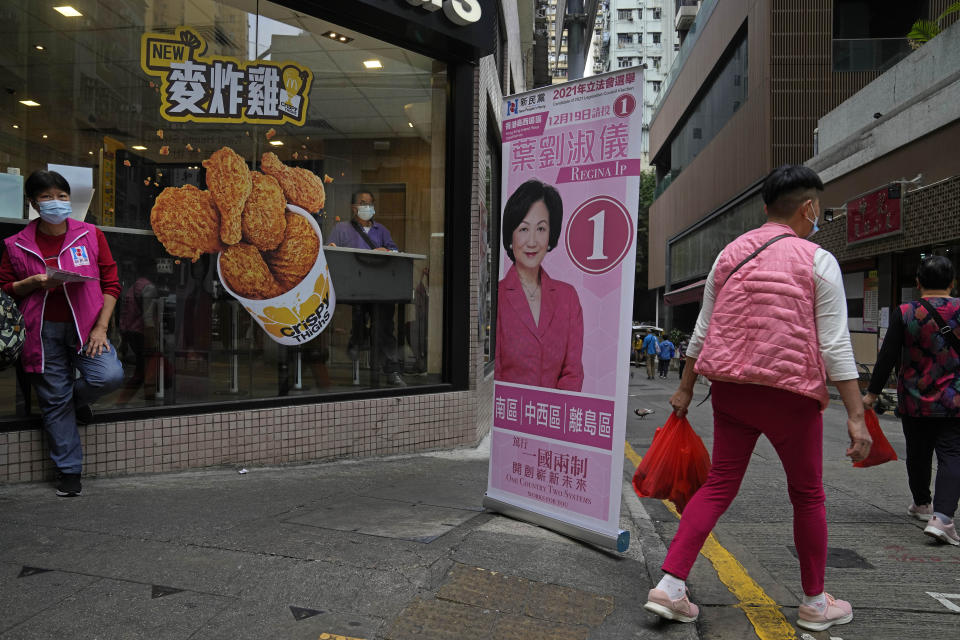 A banner of Regina Ip Lau Suk-yee, a pro-establishment candidate, is displayed on a street in Hong Kong, Thursday, Dec. 16, 2021. Hong Kong voters are preparing to vote for the first time this weekend since election laws were changed, amid a dearth of opposition candidates months after the city began cracking down on dissent. The legislative elections will be held on Sunday, Dec. 19, 2021. (AP Photo/Kin Cheung)