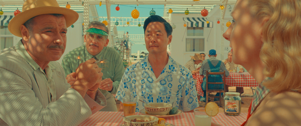 liev schreiber as jj kellogg, steve carell as motel manager, stephen park as roger cho, and hope davis as sandy borden in wes anderson's asteroid city
