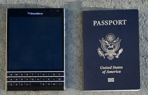 BlackBerry Passport next to a real passport