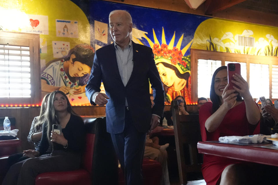 President Joe Biden walks to speak at a campaign event at El Portal restaurant Tuesday, March 19, 2024, in Phoenix. (AP Photo/Jacquelyn Martin)