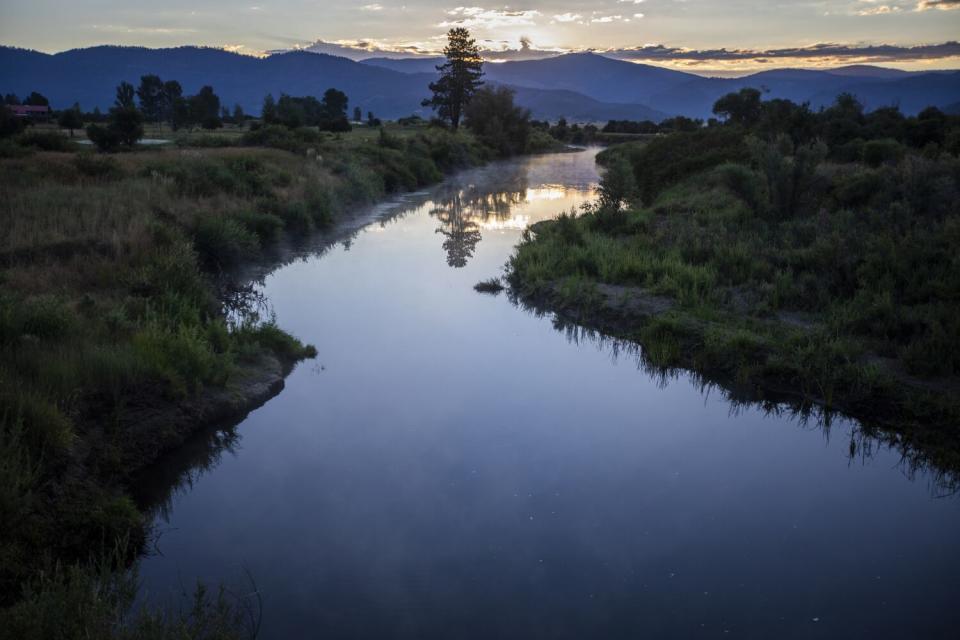 At dawn, steam rises from calm Indian Creek between Crescent Mills and Taylorsville.