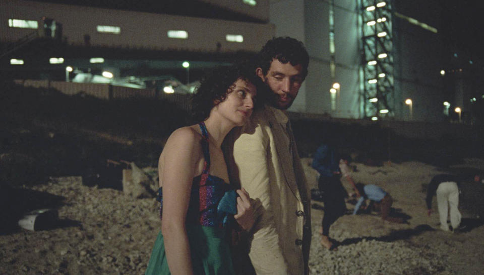 This image released by Neon shows Carol Duarte, left, and Josh O'Connor in a scene from "La Chimera." (Neon via AP)