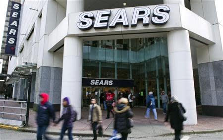 People walk past the main Sears store in downtown Vancouver, British Columbia in this file photo taken February 23, 2011. REUTERS/Andy Clark/Files