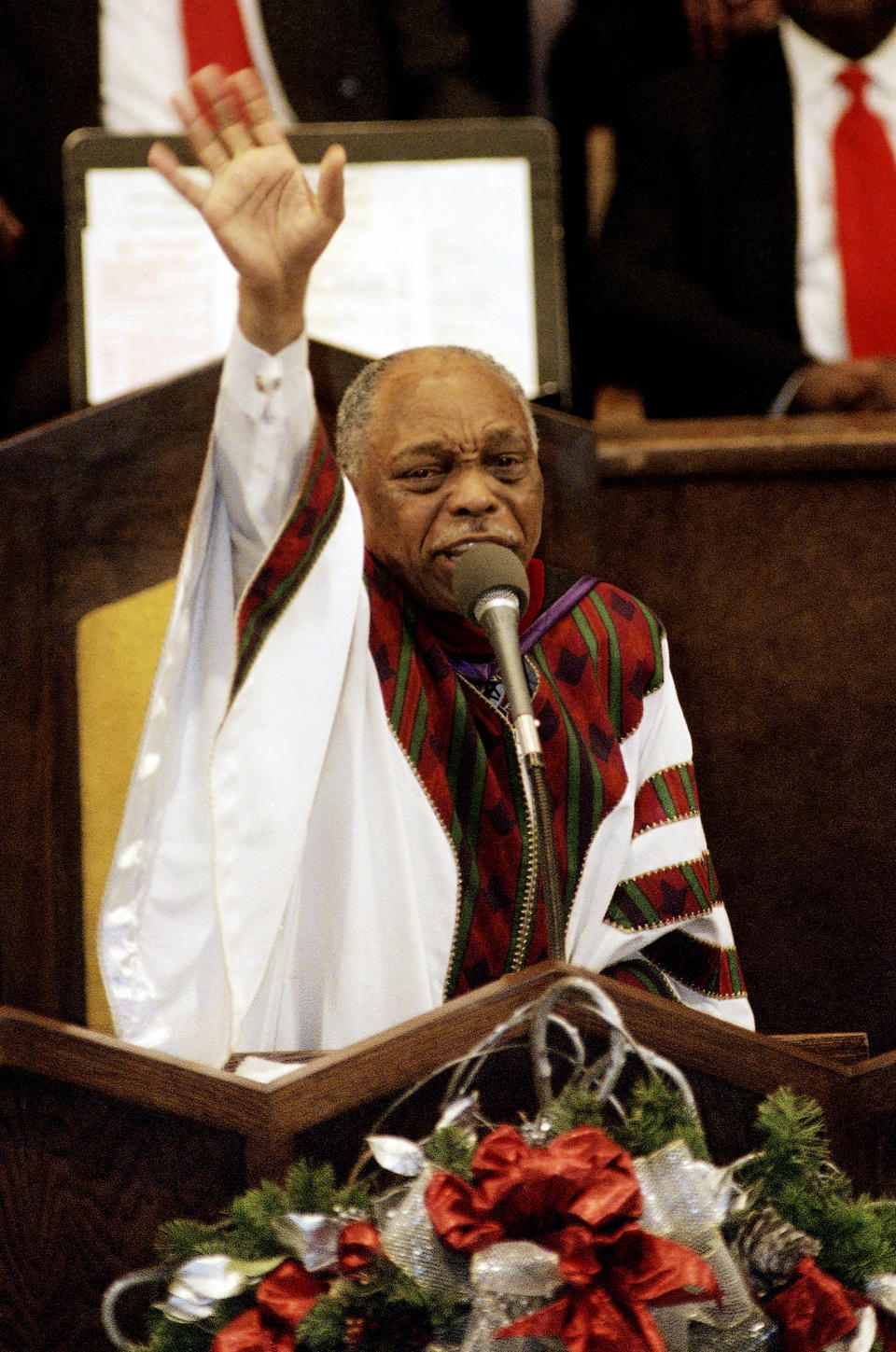 FILE - The Rev. Cecil Murray Sr., of the First African Methodist Episcopal, preaches to his congregation, Sunday, Dec. 20, 1998, in Los Angeles. Murray, an influential pastor and civil rights leader who gained international attention for his efforts to help Los Angeles recover from one of the country's worst race riots, died Friday, April 5, 2024. He was 94. (AP Photo/William Wilson Lewis III, File)