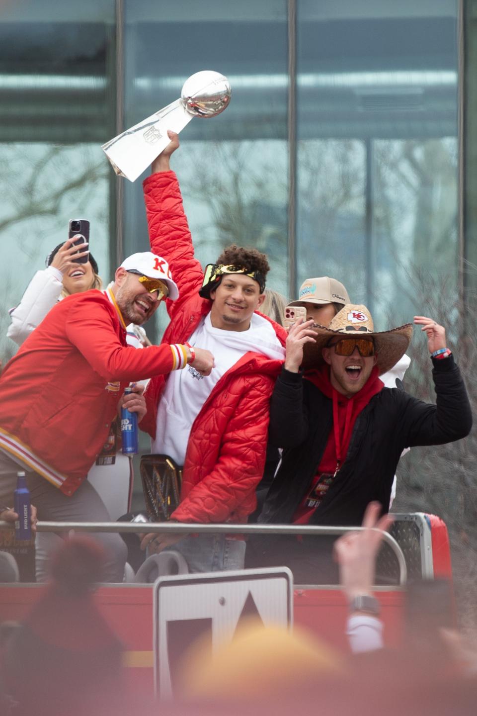 Chiefs quarterback Patrick Mahomes holds up the Lombardi trophy during Wednesday's Super Bowl LVII parade through downtown Kansas City, Missouri. Kansans can now show their support for the team with a distinct license plate.