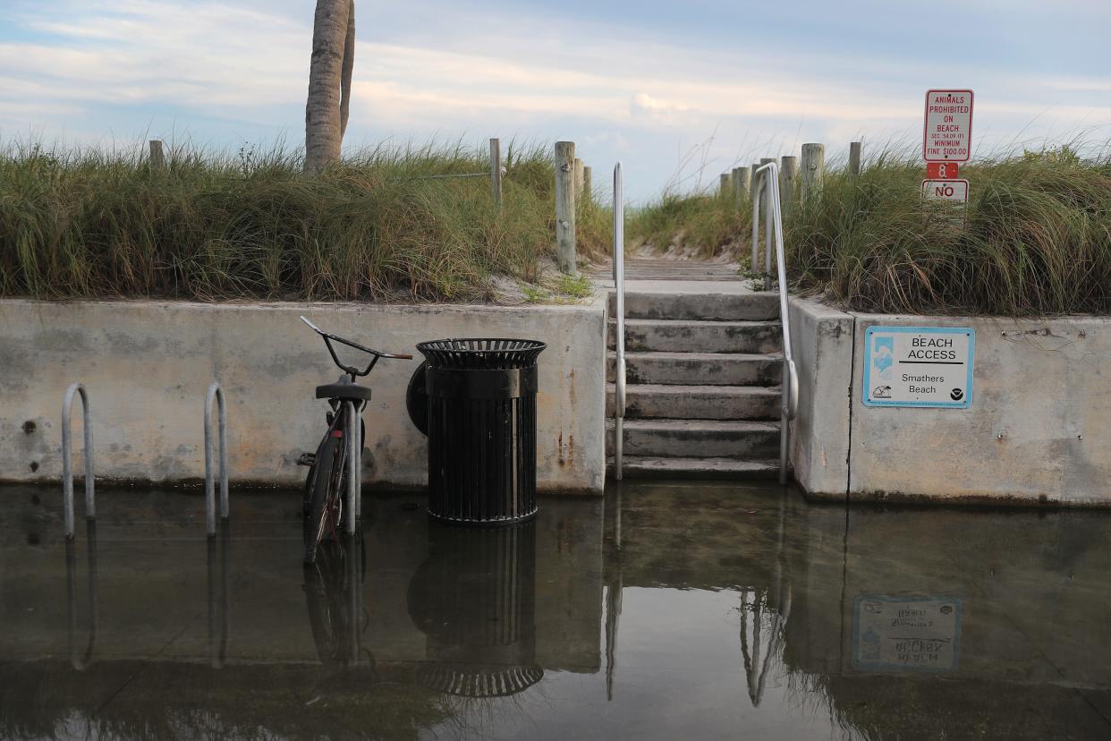 Water floods part of a street that runs near the Strait of Florida during the seasonal king tides on October 26, 2019 in Key West, Florida. Researchers estimated that the Florida Keys will likely see increased flooding as sea levels continue to rise due to various factors including global warming.