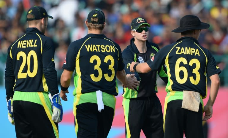 Australia captain Steve Smith (2nd R) speaks with teammates Peter Nevill (L), Shane Watson (C) and Adam Zampa (R) during the World T20 match against New Zealand in Dharamsala on March 18, 2016