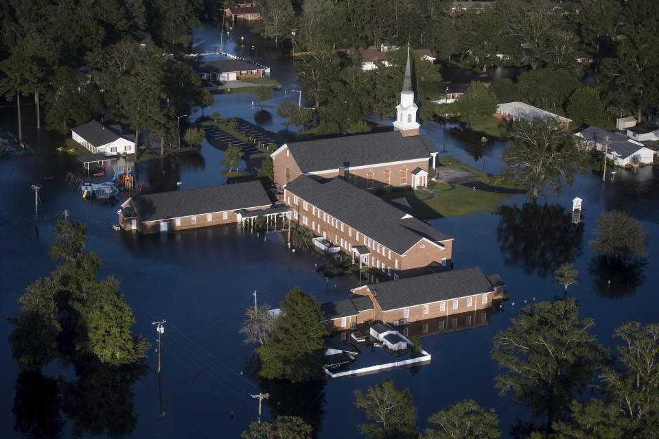 Floodwaters inundate a church after Hurricane Florence struck the Carolinas Monday, Sept. 17, 2018, in Conway, S.C. (AP Photo/Sean Rayford)