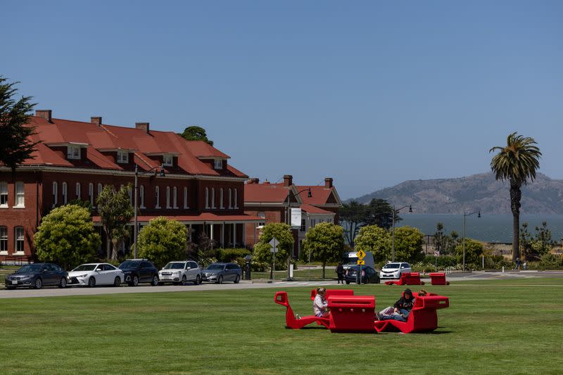 People enjoy the afternoon in Presidio, a former military base-turned-national park in San Francisco