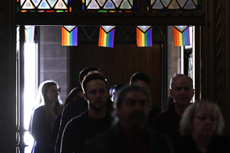 FILE - Friends and family arrive for a memorial service for Daniel Aston at Shove Memorial Chapel on the Colorado College campus on Dec. 7, 2022, in Colorado Springs, Colo. Aston, a 28-year-old transgender man, was one of five people killed in the Club Q mass shooting on Nov. 19. (RJ Sangosti/The Denver Post via AP, Pool, File)