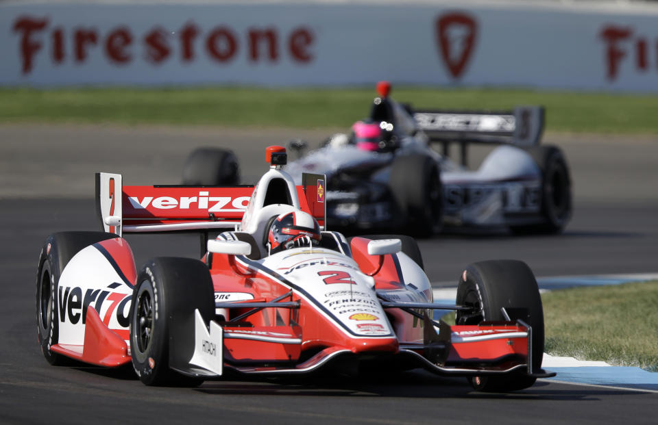 Juan Pablo Montoya, of Colombia, leads Franck Montagny, of France, through turn 2 during practice for the inaugural Grand Prix of Indianapolis IndyCar auto race at the Indianapolis Motor Speedway in Indianapolis, Thursday, May 8, 2014. (AP Photo/Michael Conroy)