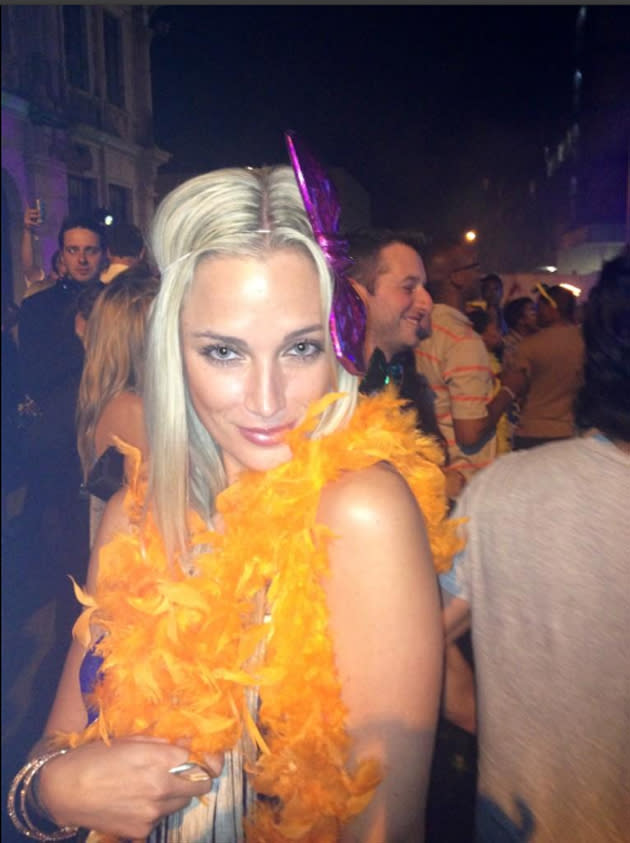 <p>Reeva is dressed bright orange feathers in a photo posted on Twitter. She was born in Cape Town and moved to Johannesburg to pursue modelling (Twitter: Reeva Steenkamp)</p>