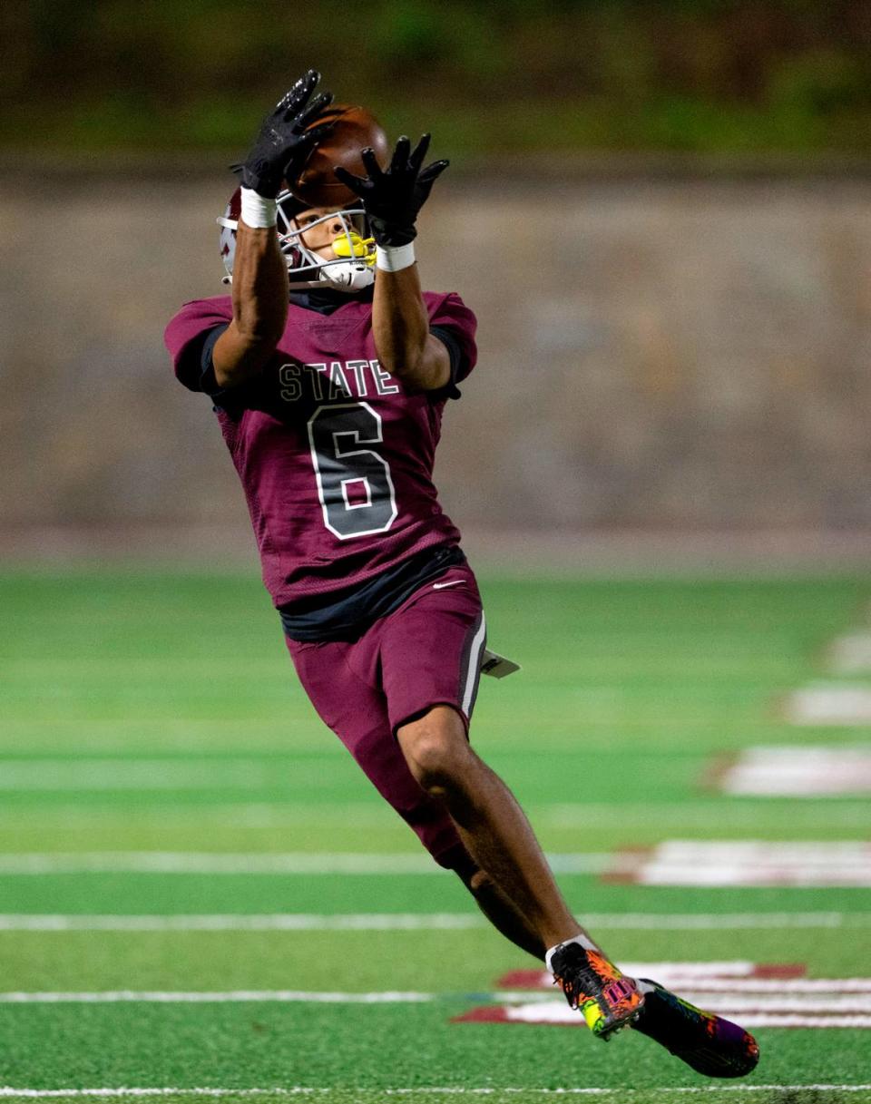 State College’s Daimear Coad makes a catch and runs it in for a touchdown during the game against Altoona on Friday, Sept. 15, 2023.