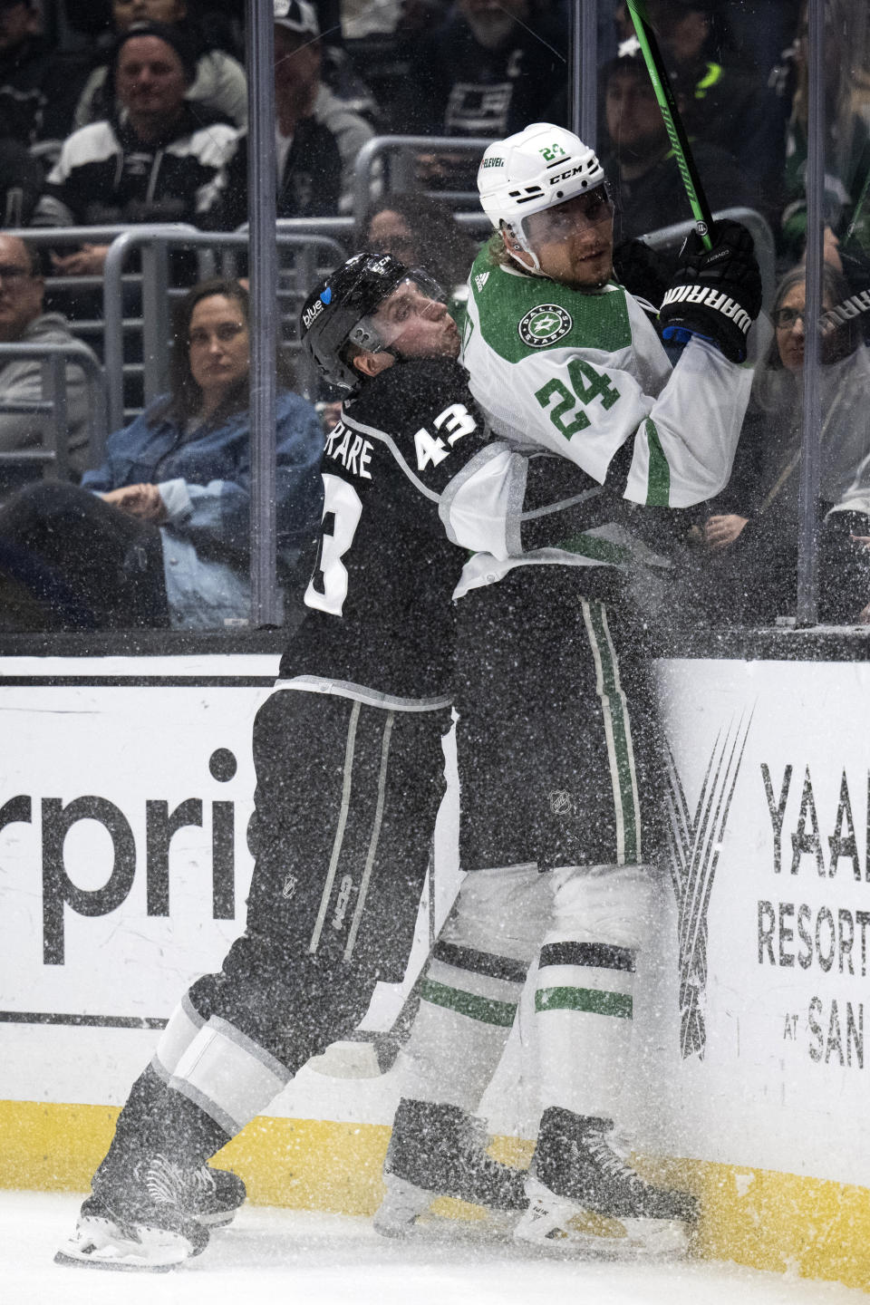 Los Angeles Kings defenseman Jacob Moverare (43) checks Dallas Stars center Roope Hintz (24) during the first period of an NHL hockey game, Saturday, March 9, 2024, in Los Angeles. (AP Photo/Kyusung Gong)