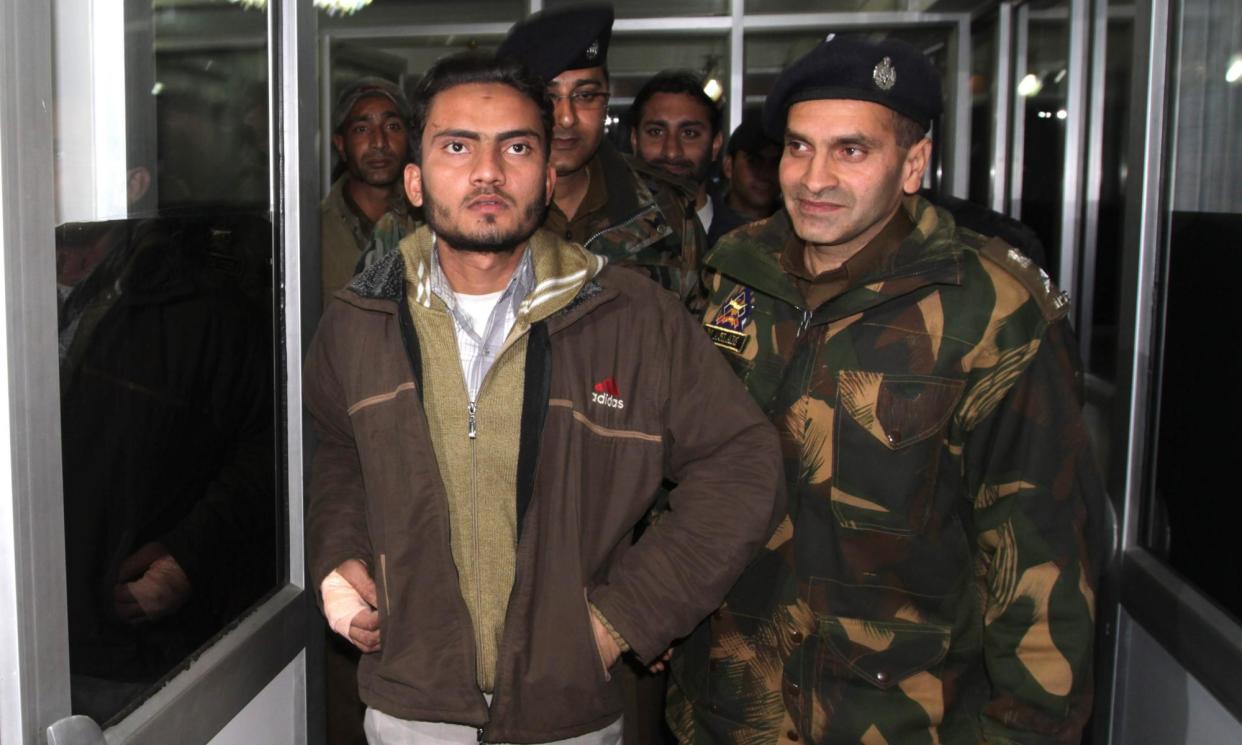 <span>Saleem Rehmani being detained in 2010. His killing in 2022, previously reported as the result of a suspected armed robbery, was allegedly planned out of the UAE.</span><span>Photograph: Farooq Khan/EPA</span>