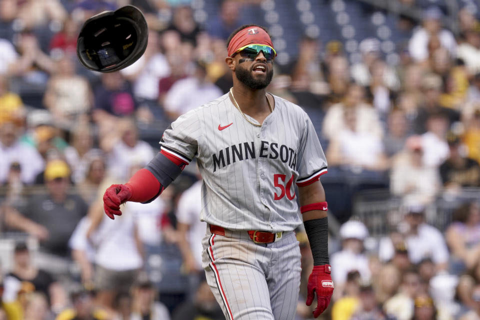 Minnesota Twins' Willi Castro reacts after getting hit by a pitch by Pittsburgh Pirates relief pitcher Ben Heller during the 10th inning of a baseball game, Sunday, June 9, 2024, in Pittsburgh. (AP Photo/Matt Freed)