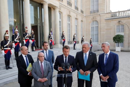 Macron, Vitorino, Castaner and Avramopoulos deliver a joint statement at the Elysee Palace in Paris