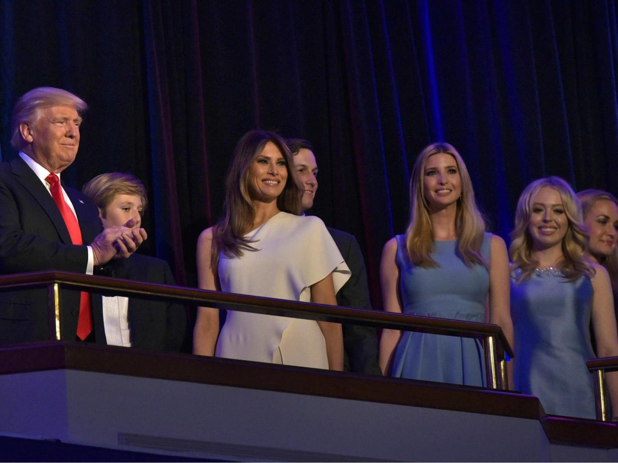 President Donald Trump applauds next to his soon Barron, his wife Melania, son-in-law Jared Kushner, and daughters Ivanka and Tiffany during election night on 9 November 2016: MANDEL NGAN/AFP/Getty Images