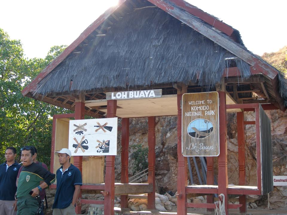 In this undated photo provided by researcher Bryan Fry, park rangers stand a kiosk at Komodo National Park in Indonesia. For years the government has been trying to figure out how to best capitalize on the park, most recently designating it part of the country’s “10 New Balis” initiative -- an effort to draw more tourists, as the island of Bali did before border restrictions during the COVID-19 pandemic. (Bryan Fry via AP)