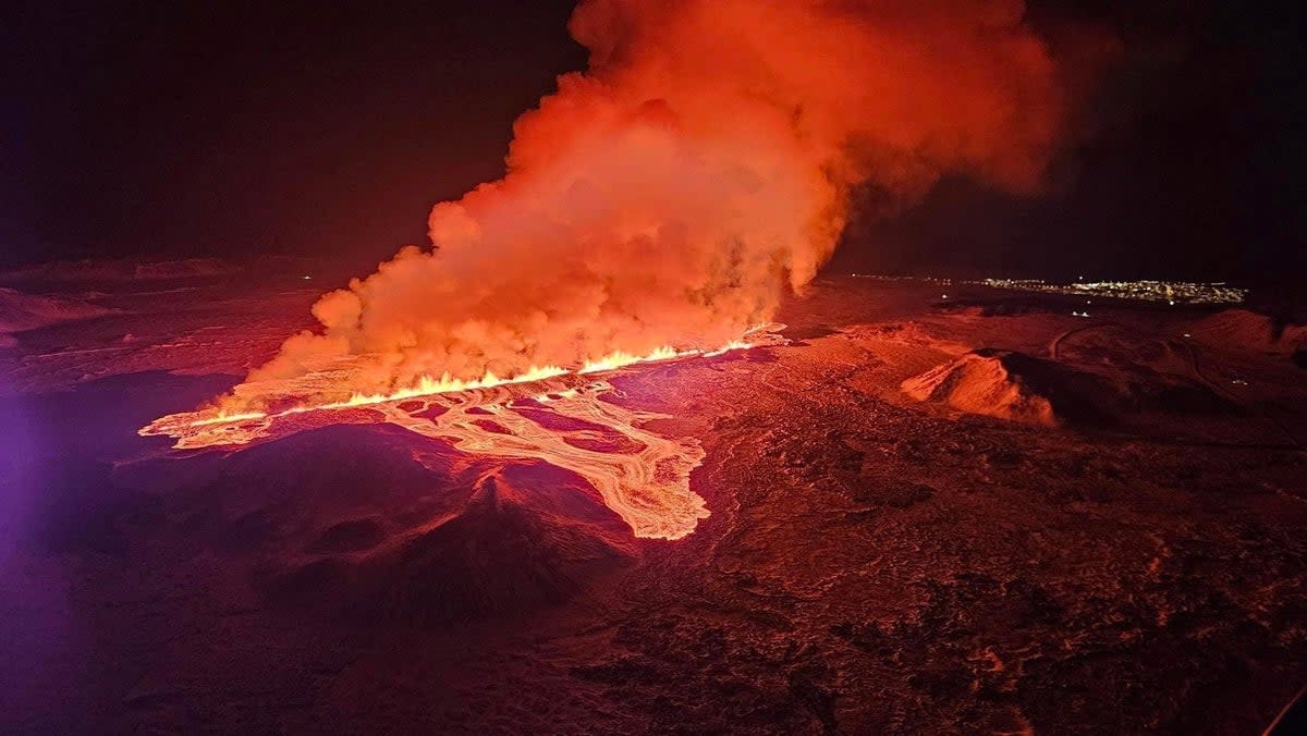 A volcano spews lava and smoke as it erupts, near Grindavik, on Reykjanes Peninsula (Reuters)