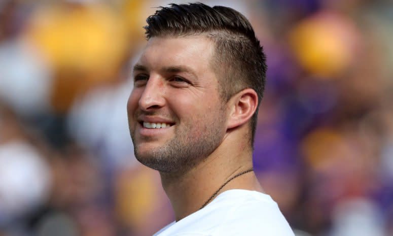 Tim Tebow on the field before a game.