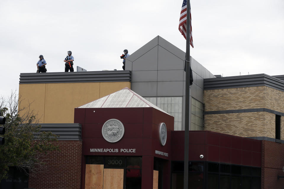 Minneapolis police stand guard against protesters