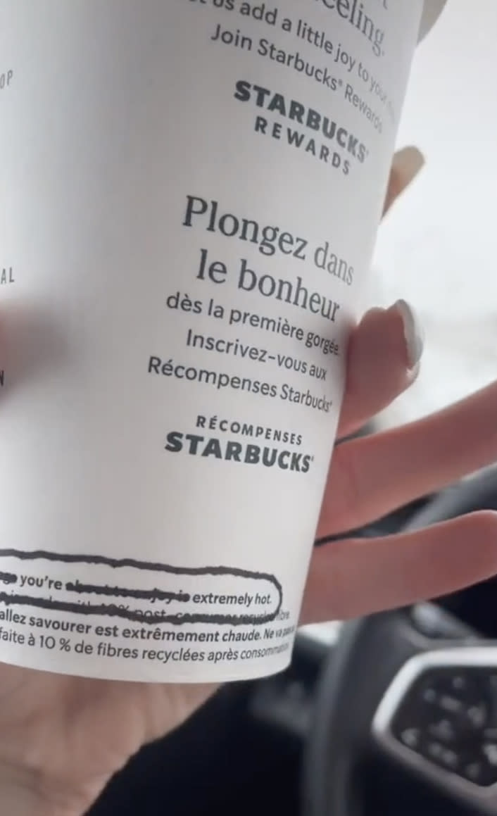 The woman was surprised by the 'secret note' left on her coffee cup. Source: TikTok/ chance_twins