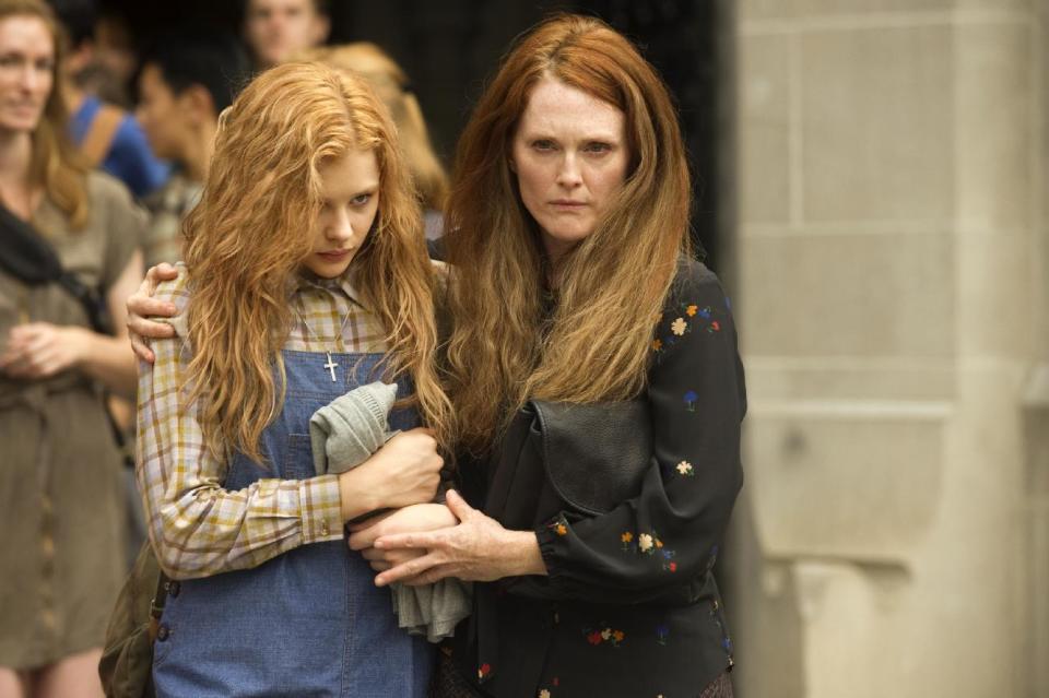 This photo released by Sony Pictures shows Chloe Moretz, left, and Julianne Moore in a scene from the horror film "Carrie." (AP Photo/Sony Pictures, Michael Gibson)