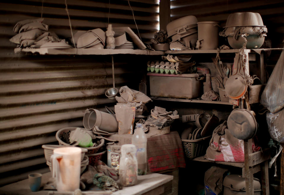 <p>Kitchen shelves are covered with ash after the eruption of the Fuego volcano at San Miguel Los Lotes in Escuintla, Guatemala, June 6, 2018. (Photo: Carlos Jasso/Reuters) </p>