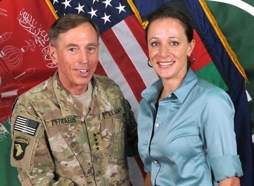 This July 13, 2011 handout image provide by International Security Assistance Force NATO, shows David Petraeus posing with his biographer Paula Broadwell in Afghanistan. Two months after hanging up his uniform, Petraeus started an affair with Broadwell, a former army officer 20 years his junior who traveled with him in Afghanistan and has written a glowing biography of him