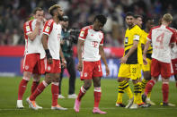 Bayern Munich players react disappointed after the German Bundesliga soccer match between FC Bayern Munich and Borussia Dortmund at the Allianz Arena stadium, in Munich, Germany, Saturday, March 30, 2024. (AP Photo/Matthias Schrader)