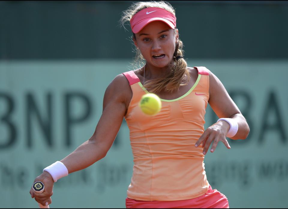 US Lauren Davis hits a return to US Christina McHale during their Women's Singles 2nd Round tennis match of the French Open tennis tournament at the Roland Garros stadium in Paris.        (Photo credit should read PASCAL GUYOT/AFP/GettyImages)