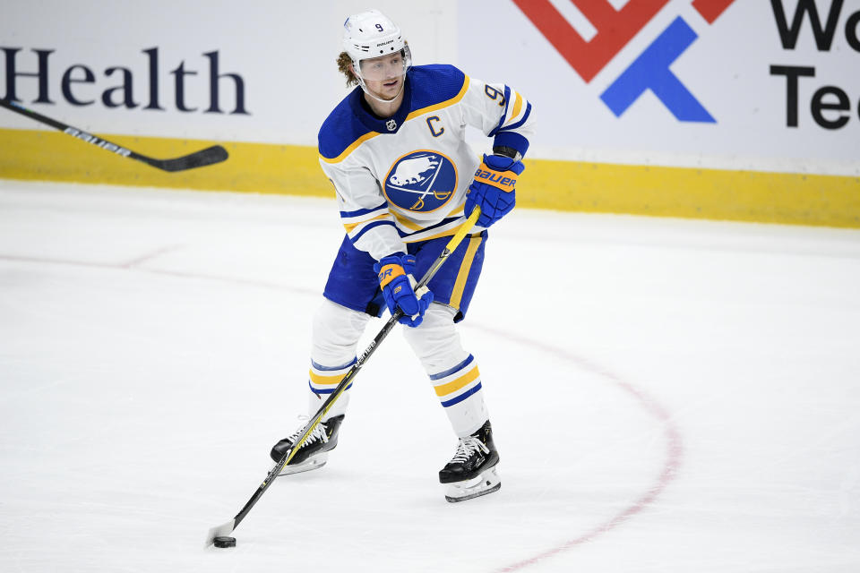 Buffalo Sabres center Jack Eichel (9) skates with the puck during the first period of an NHL hockey game against the Washington Capitals, Sunday, Jan. 24, 2021, in Washington. (AP Photo/Nick Wass)