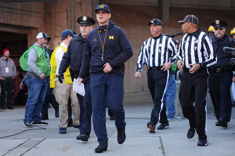 Jim Harbaugh will not be coaching against Ohio State next week.