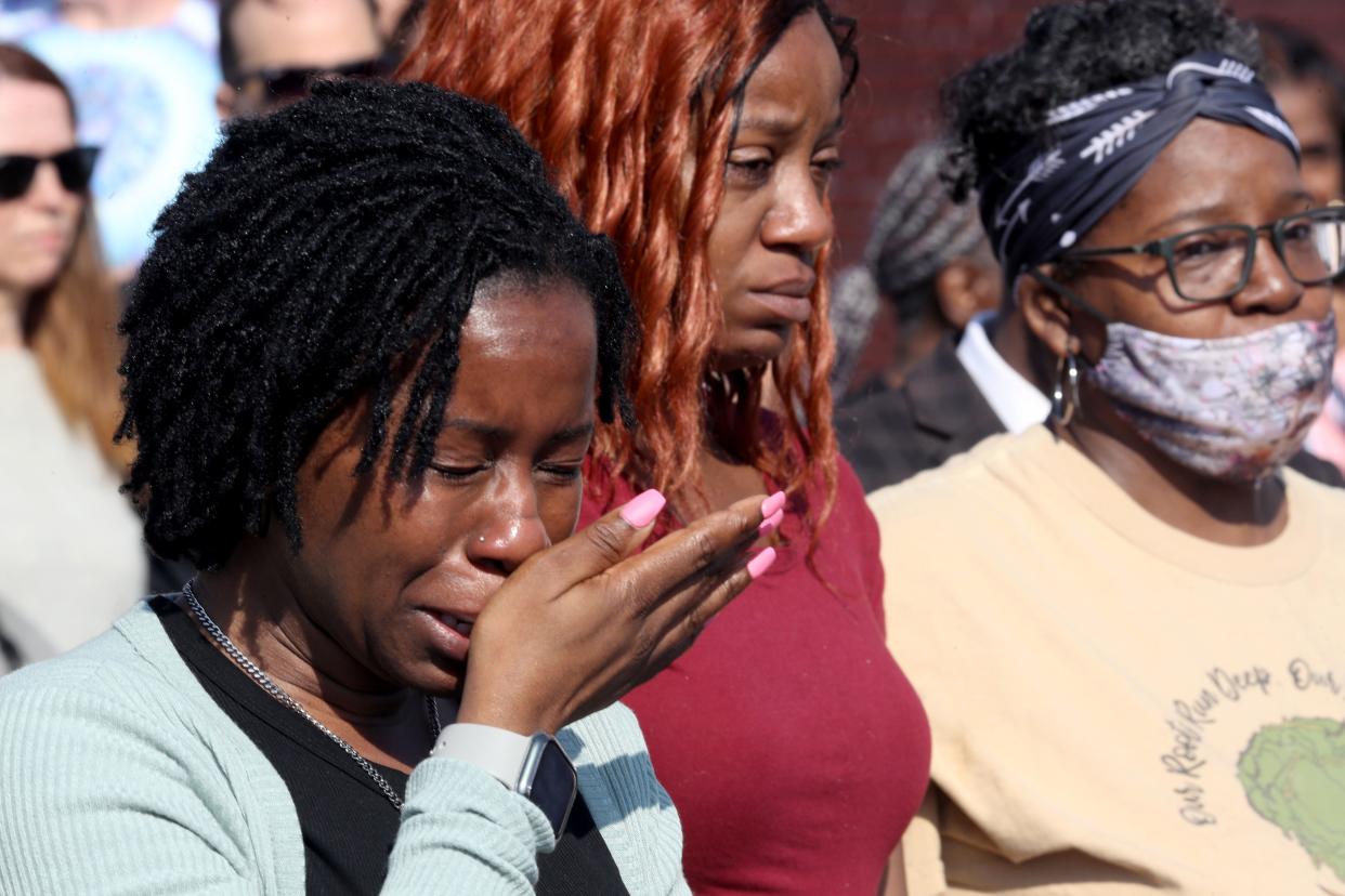 Takesha Leonard cries during a prayer vigil May 15 across from the Tops supermarket where a gunman killed 10 people the day before.