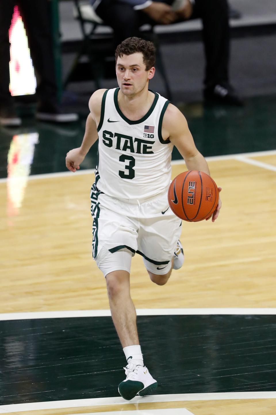 Michigan State's Foster Loyer dribbles the ball during the second half against Eastern Michigan, Nov. 25, 2020 in East Lansing.