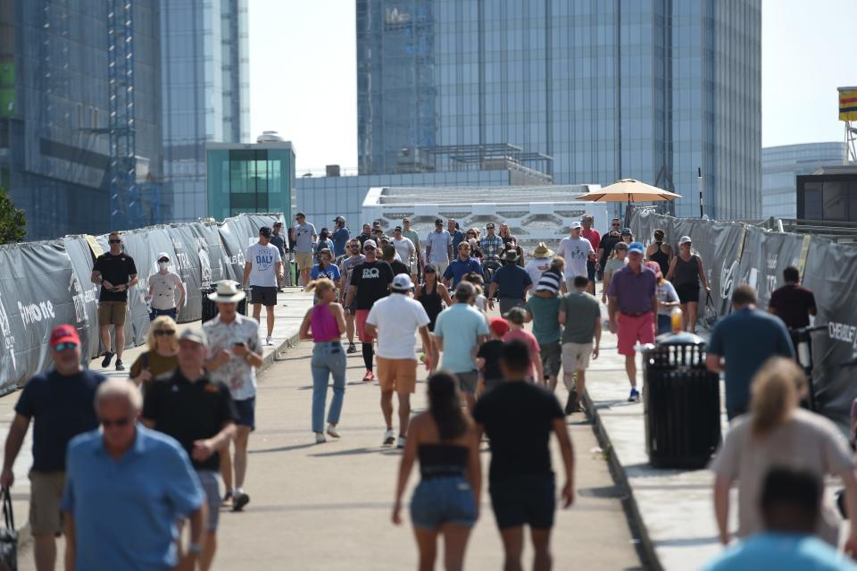 Throngs of fans flow into the Music City Grand Prix race venue around Nissan Stadium Sunday in Nashville.