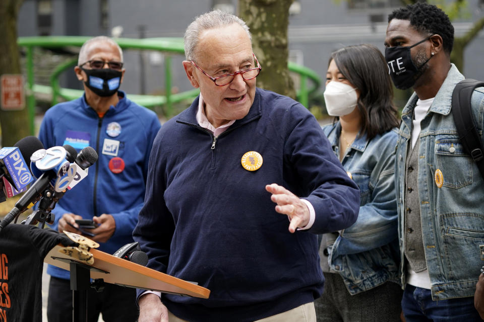 New York Senator Chuck Schumer speaks at a news conference outside an early voting site in New York, Tuesday, Oct. 27, 2020. New Yorkers lined up to vote early for a fourth consecutive day Tuesday after a weekend that saw a crush of more than 400,000 voters statewide. The unofficial tally shows about 194,000 voters this weekend in New York City, where some people waited an hour or more in lines that stretched for several blocks. (AP Photo/Seth Wenig)