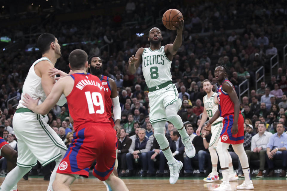 Boston Celtics guard Kemba Walker (8) drives to the basket against the Detroit Pistons during the first half of an NBA basketball game in Boston, Wednesday, Jan. 15, 2020. (AP Photo/Charles Krupa)