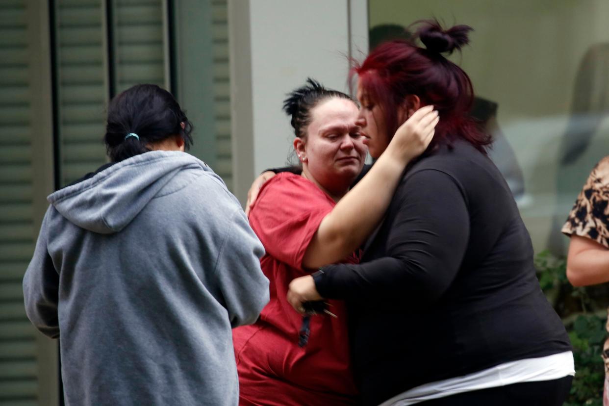 People react outside the Civic Center in Uvalde, Texas, Tuesday, May 24, 2022. 