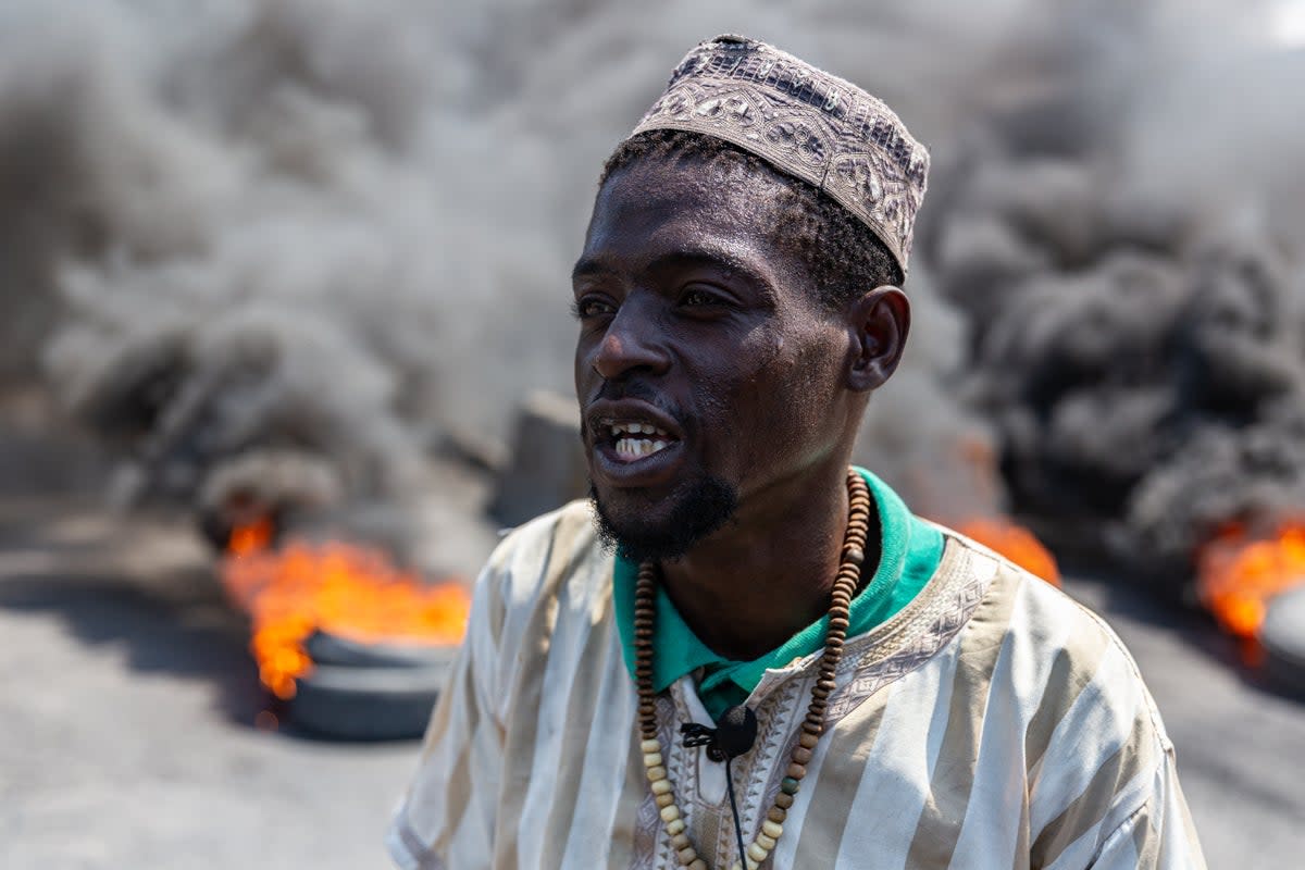 Activist reacts during a demonstration against CARICOM for the decision following the resignation of Haitian Prime Minister Ariel Henry (Anadolu via Getty Images)