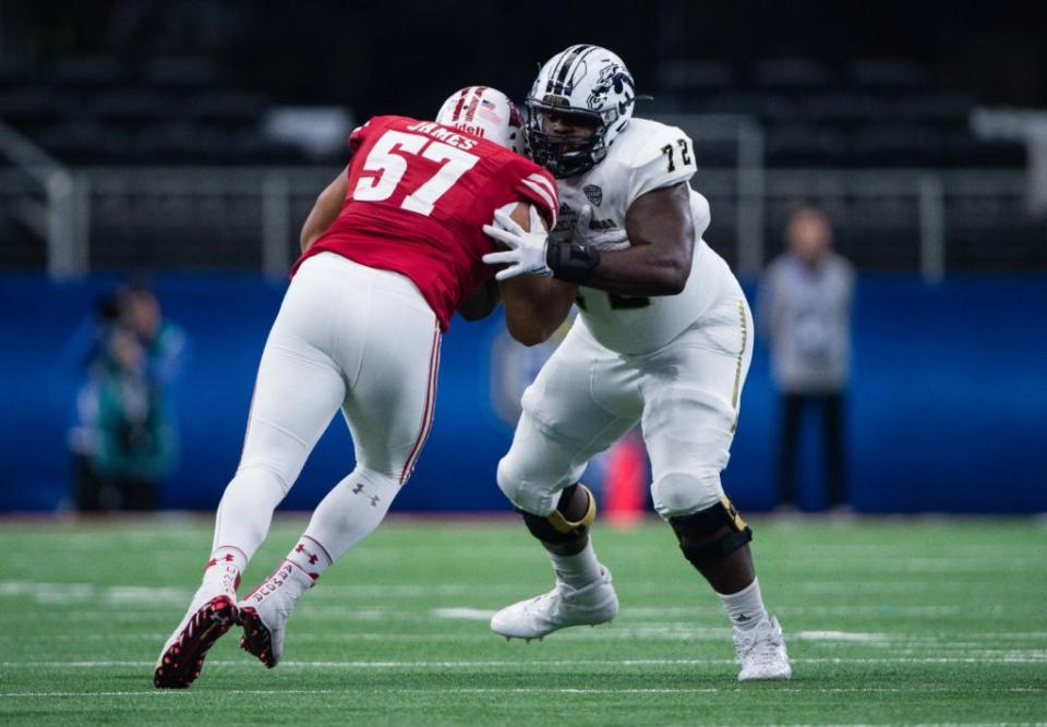 Jan 2, 2017; Arlington, TX, USA; Wisconsin Badgers defensive end Alec James (57) and Western Michigan Broncos offensive lineman Taylor Moton (72) in action in the 2017 Cotton Bowl game at AT&T Stadium. The Badgers defeat the Broncos 24-16. Mandatory Credit: Jerome Miron-USA TODAY Sports