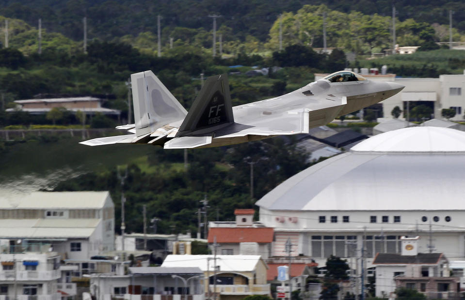 In this Aug. 14, 2012 photo, a U.S. Air Force F-22 Raptor stealth fighter takes off from Kadena Air Base on the southern island of Okinawa in Japan. The U.S. is hoping a dozen F-22 stealth fighters now roaring through the skies of southern Japan will prove its most prized combat aircraft is finally ready to resume full operations after years of investigations into why its pilots were getting dizzy and disoriented. But questions remain over whether the Air Force has taken enough action to fix a potentially bigger problem - the shriveling of programs to test cockpit life support systems after nearly 20 years of budget cuts, downsizing and outsourcing. (AP Photo/Greg Baker)