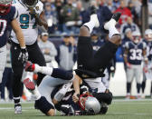 <p>New England Patriots quarterback Tom Brady, front, is sacked by Jacksonville Jaguars defensive end Dante Fowler, top, during the first half of the AFC championship NFL football game, Sunday, Jan. 21, 2018, in Foxborough, Mass. (AP Photo/Winslow Townson) </p>