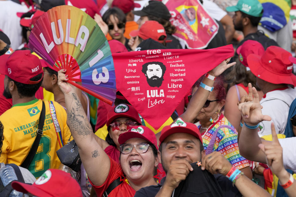 Supporters of Luiz Inacio Lula da Silva celebrate his inauguration as new president outside the Planalto presidential palace in Brasilia, Brazil, Sunday, Jan. 1, 2023. (AP Photo/Andre Penner)