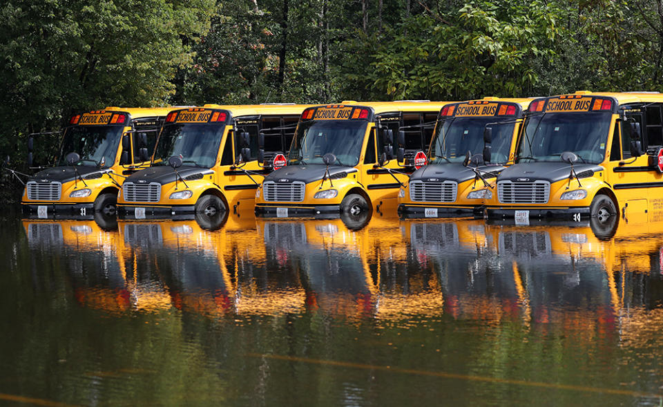 Waltham, MA – September 2: Waltham school busses looked more like moored boats off Lexington Street in Waltham, MA on Sept. 2, 2021. Flooding concerns due to the heavy rainfall from the remnants of Hurricane Ida shifted away from morning commute problems to communities along rivers in both Massachusetts and Rhode Island, where water levels were continuing to rise on Thursday. The overnight rainfall reached nearly 6 inches in some Massachusetts communities. (Photo by David L. Ryan/The Boston Globe via Getty Images)