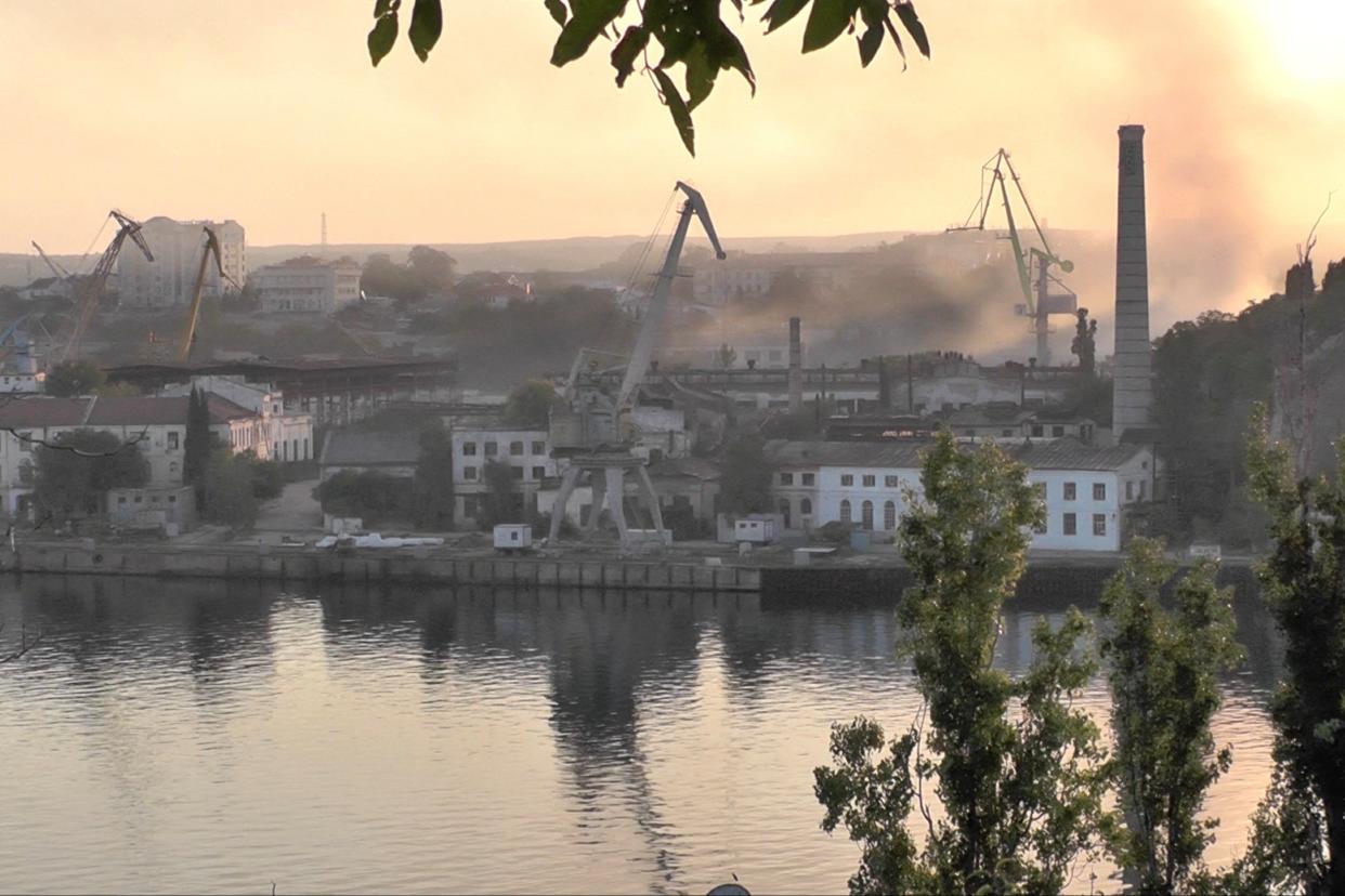 Smoke rises from the shipyard hit by Ukrainian missile attack in Sevastopol (Reutrers)