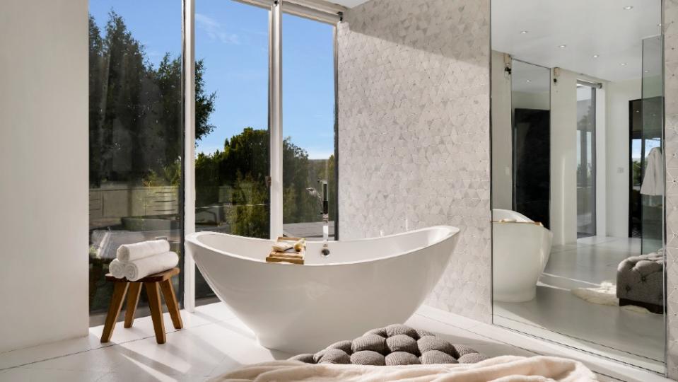 The soaking tub in one of the bathrooms - Credit: The Agency